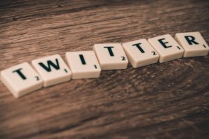 The word Twitter spelt out in Scrabble pieces.